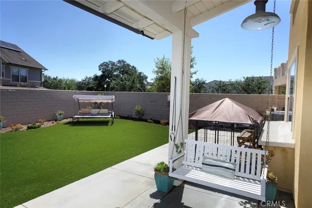 a view of a backyard with sitting area