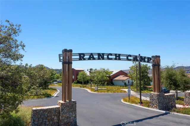 an aerial view of a house with outdoor space