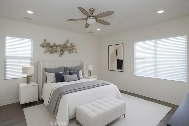 a bedroom with a large bed and a window