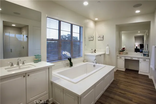 a spacious bathroom with a sink and a mirror