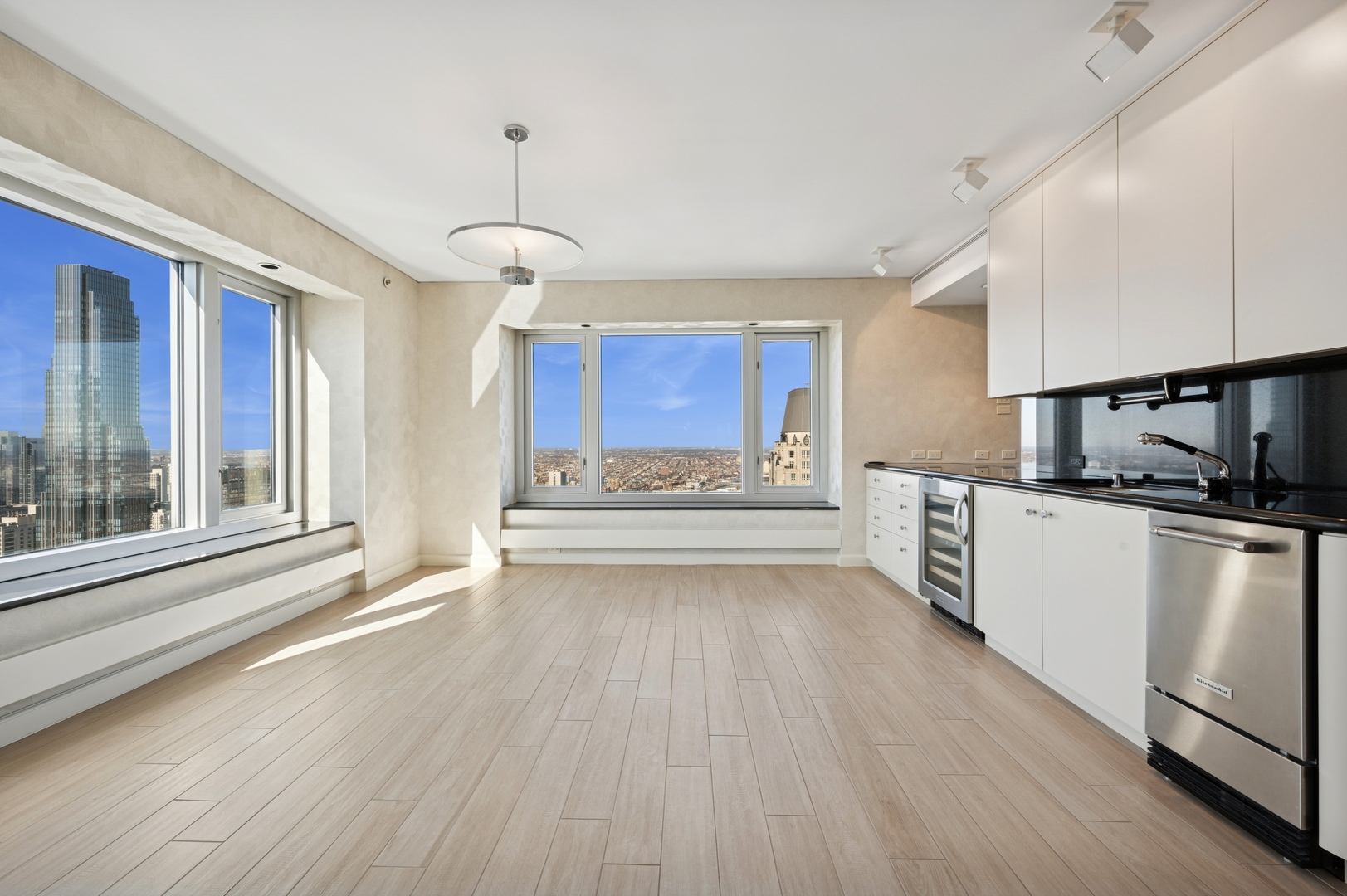 132 East Delaware Place, Unit 5201 Chicago, IL 60611 - Photo 14 of 42 a view of kitchen with microwave a stove and wooden floor