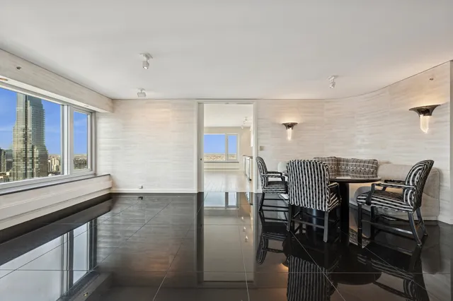 a view of an entryway with a floor to ceiling window