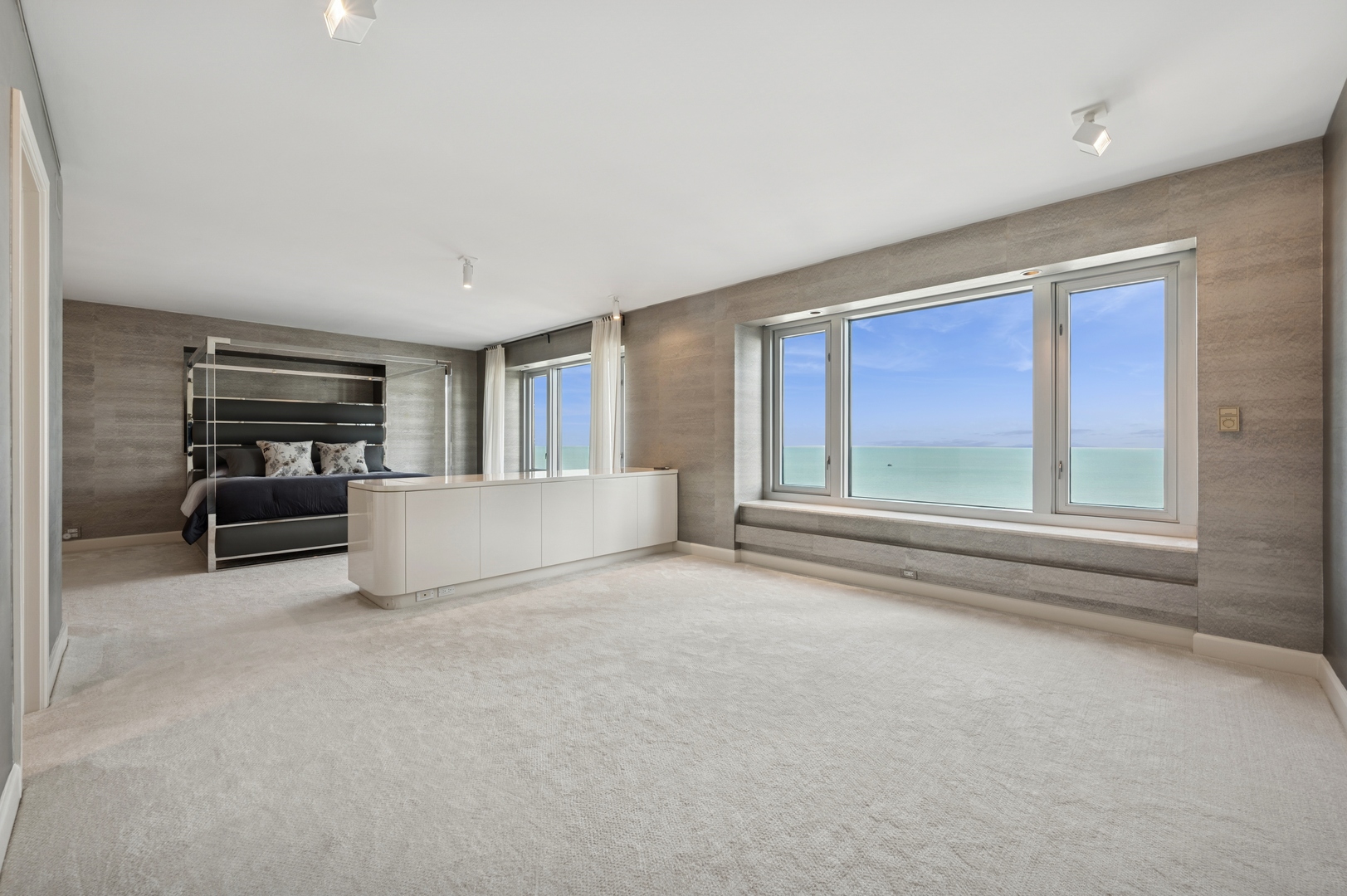 132 East Delaware Place, Unit 5201 Chicago, IL 60611 - Photo 20 of 42 a view of livingroom with furniture cabinet and windows