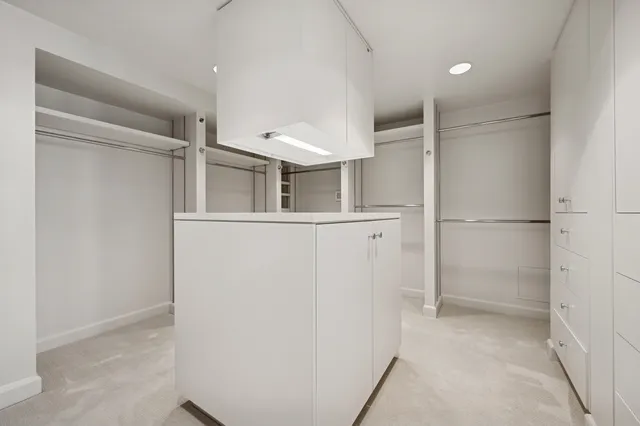 a bedroom with a bed and a cabinets