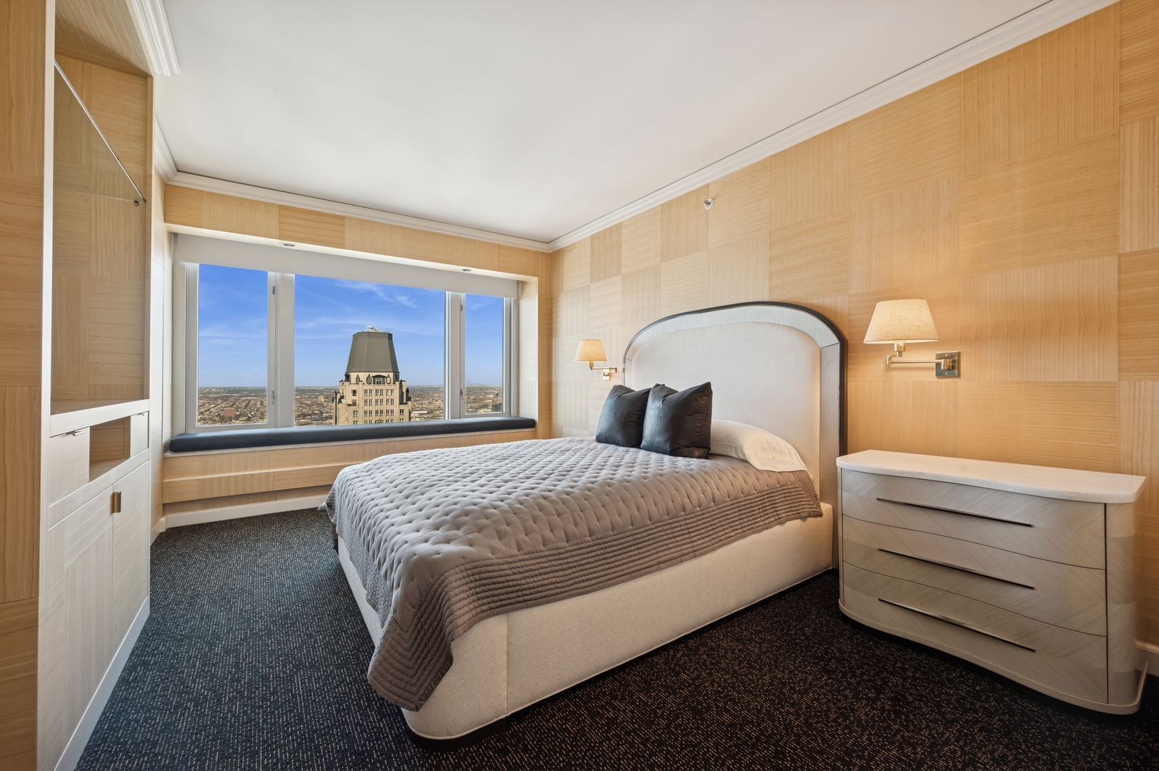 132 East Delaware Place, Unit 5201 Chicago, IL 60611 - Photo 29 of 42 a bedroom with a bed and a large window