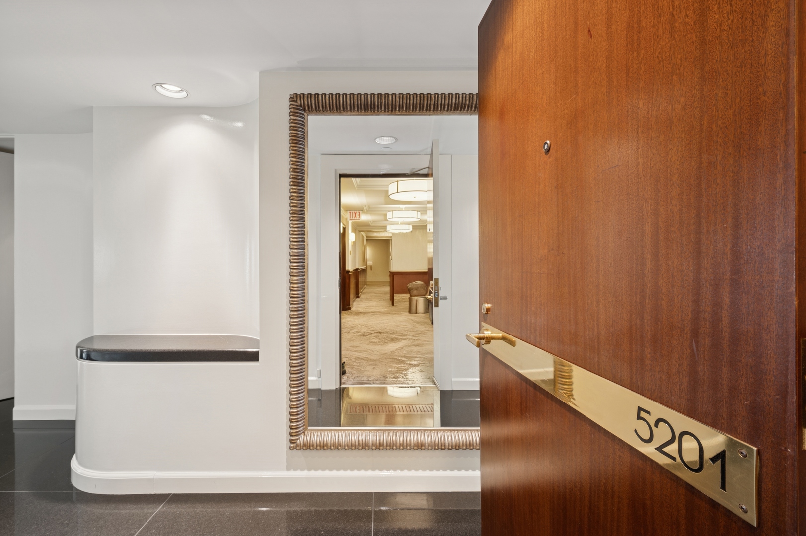 132 East Delaware Place, Unit 5201 Chicago, IL 60611 - Photo 4 of 42 a view of a hallway with wooden floor
