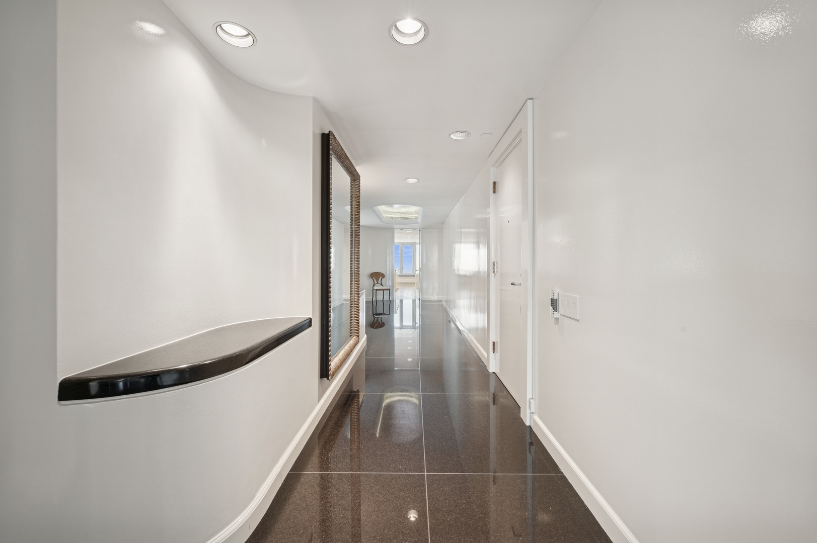 132 East Delaware Place, Unit 5201 Chicago, IL 60611 - Photo 5 of 42 a view of a hallway with wooden floor