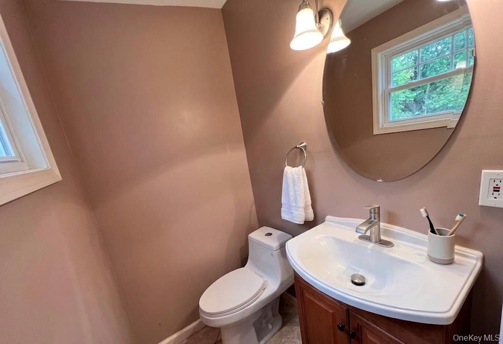 51 North Pascack Road Nanuet, NY 10954 - Photo 12 of 23 a bathroom with a toilet sink and mirror