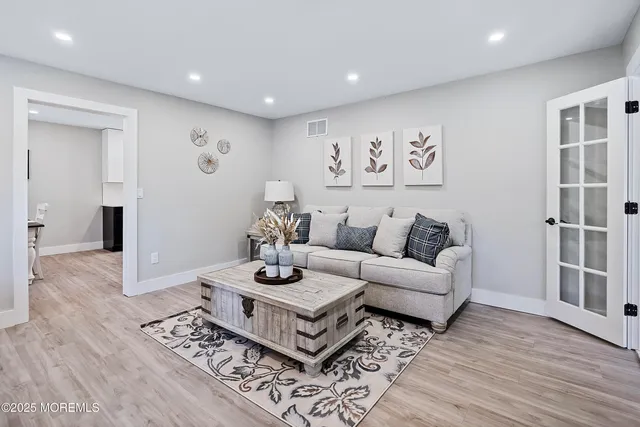 a view of a dining room with furniture wooden floor and chandelier