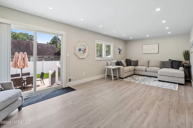 a bathroom with a toilet sink and a mirror
