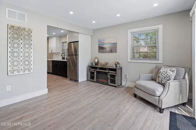a bedroom with bed and a large window