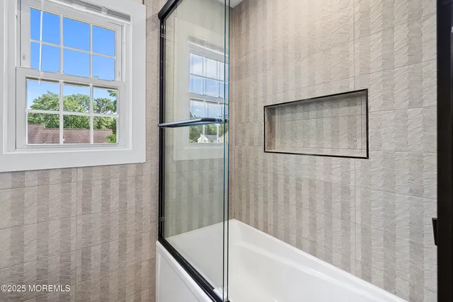 a living room with a couch and a large window