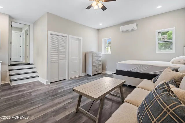 a bathroom with a sink toilet vanity and tub