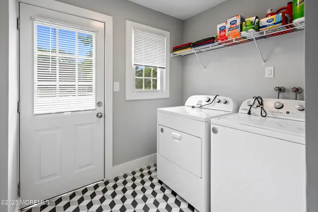 an aerial view of a house with outdoor space and a swimming pool