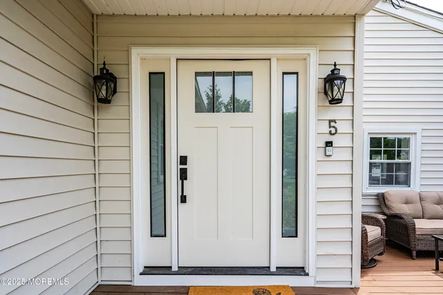 a kitchen with a sink a window and stainless steel appliances