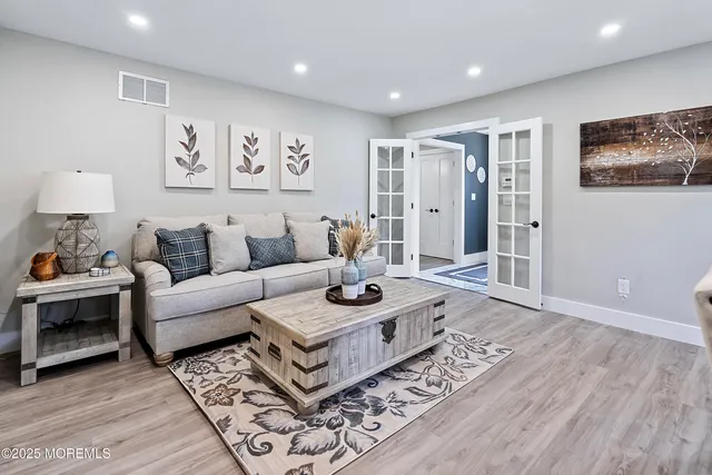 a kitchen with a dining table chairs sink and stove