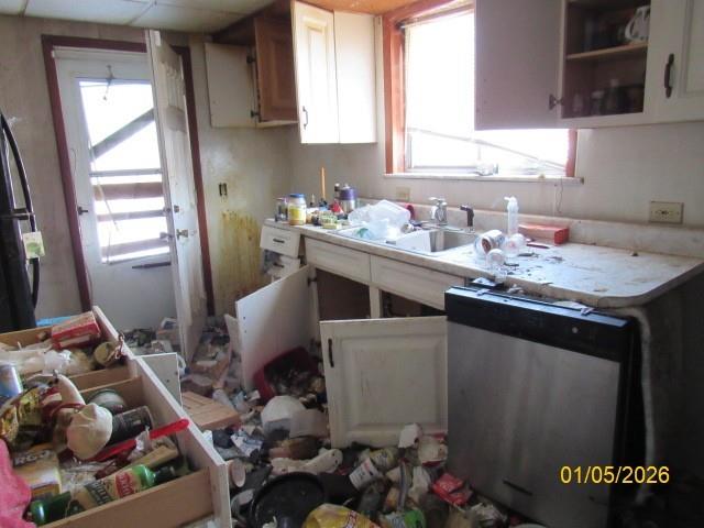 60 Feathers Avenue Uniontown, PA 15401 - Photo 7 of 17 a kitchen with a sink stove and cabinets