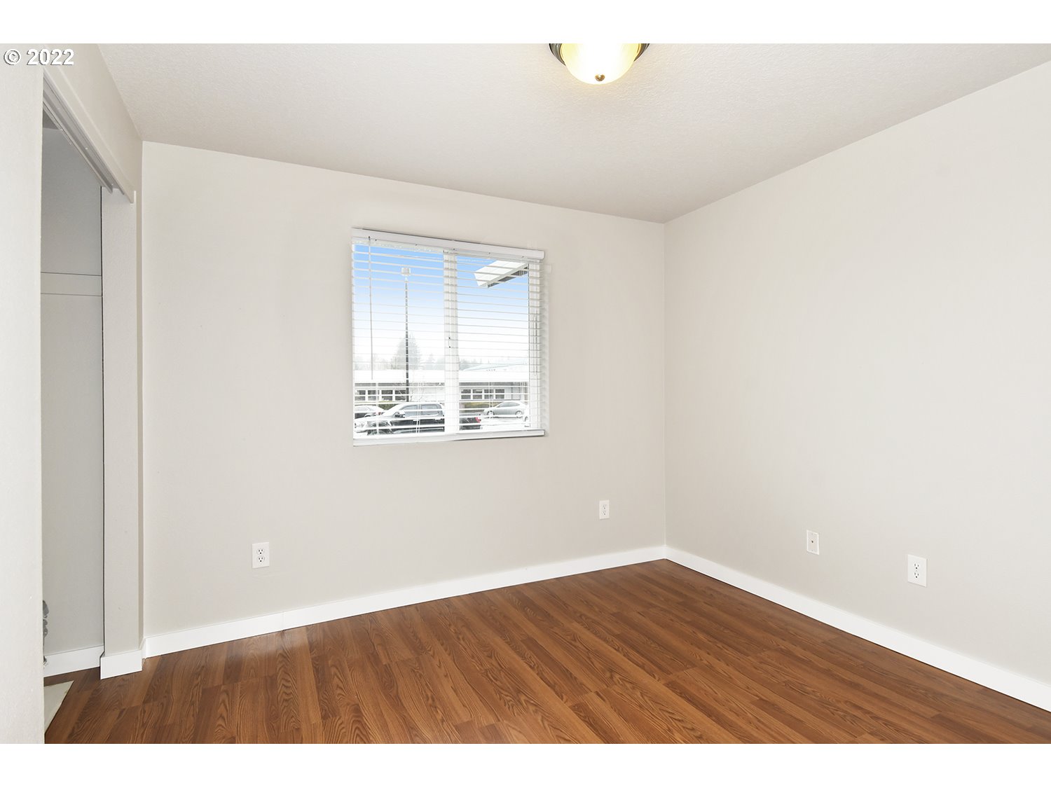 407 West Yacolt Road Yacolt, WA 98675 - Photo 15 of 21 a view of an empty room with wooden floor