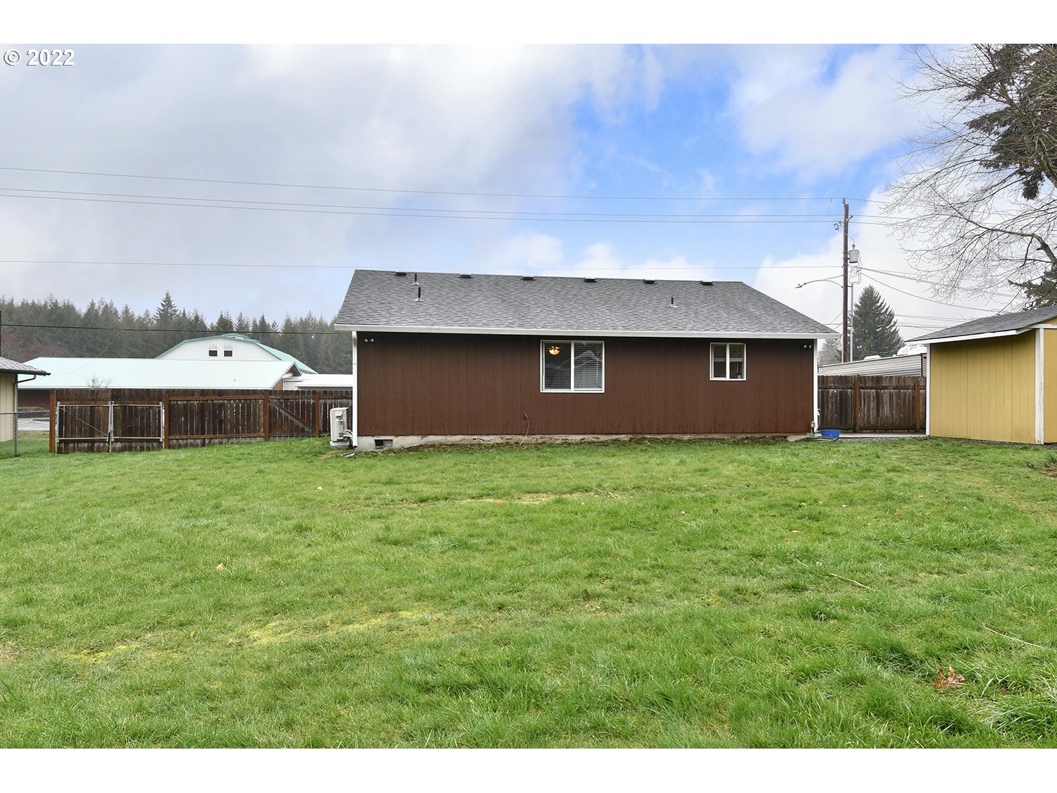 407 West Yacolt Road Yacolt, WA 98675 - Photo 18 of 21 a front view of a house with a garden