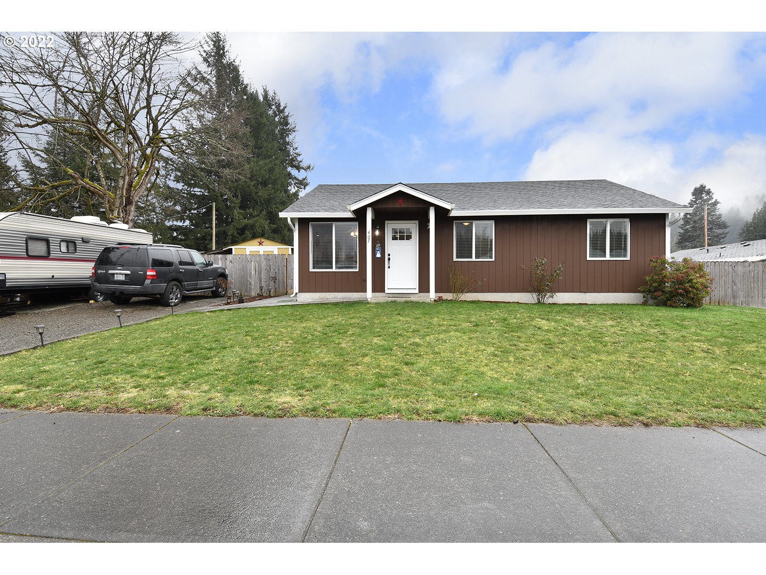 407 West Yacolt Road Yacolt, WA 98675 - Photo 2 of 21 a front view of a house with a yard and garage