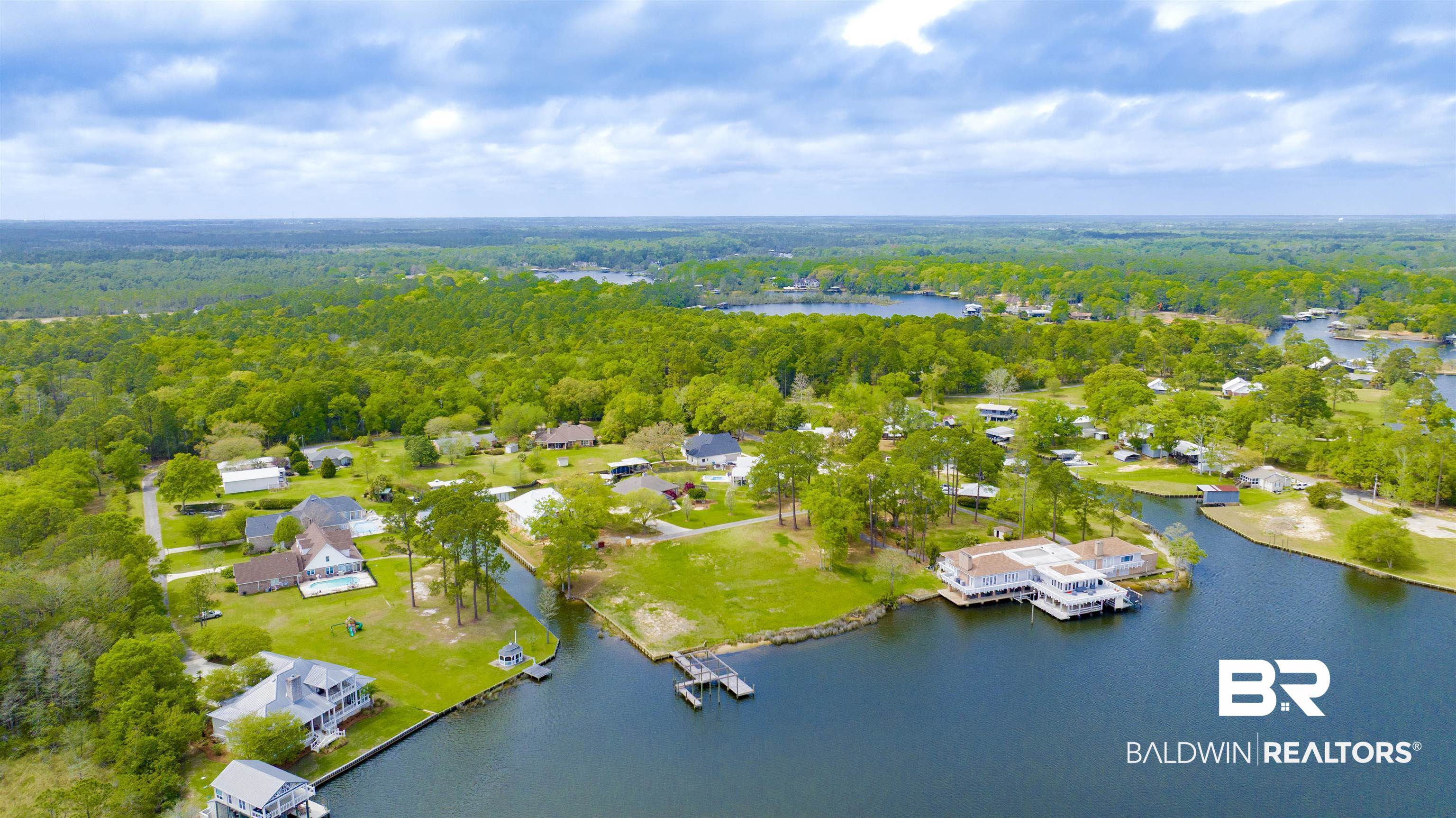 0 South Windsor Road South Theodore, AL 36582 - Photo 20 of 22 Aerial view of residential area with a heavily wooded area and a nearby body of water