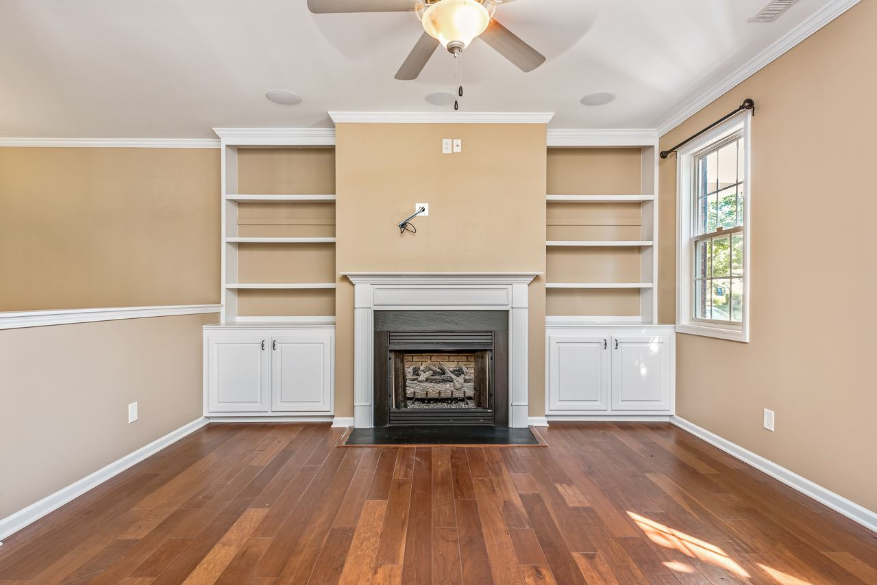 1350 Regulator Street Raleigh, NC 27603 - Photo 6 of 25 Built in Bookshelves Flank the Gas Fireplace