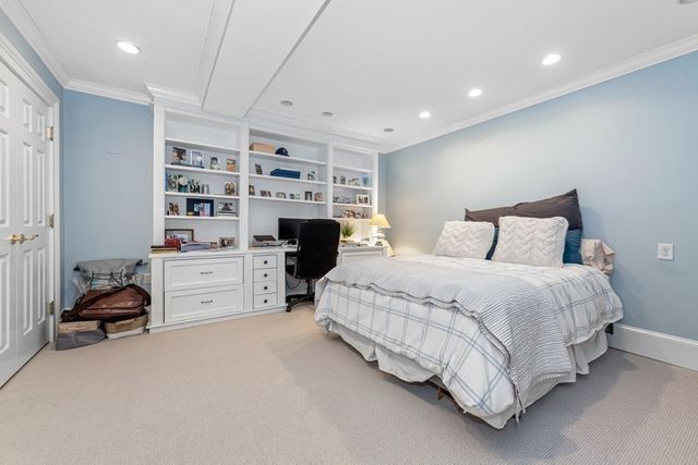 a spacious bedroom with a bed and a closet