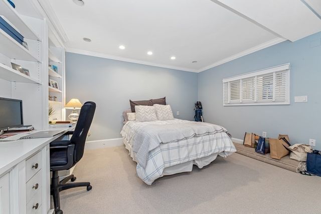 a bedroom with furniture and a bed