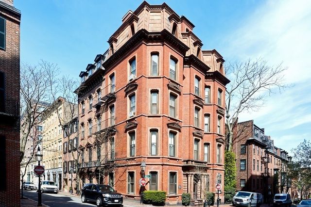 a view of a large building with a clock on the wall