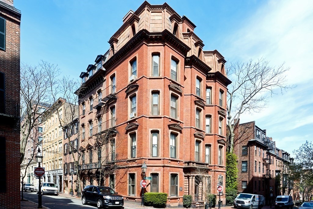 3 Myrtle Street, Unit 1 Boston, MA 02114 - Photo 20 of 25 a view of a large building with a clock on the wall