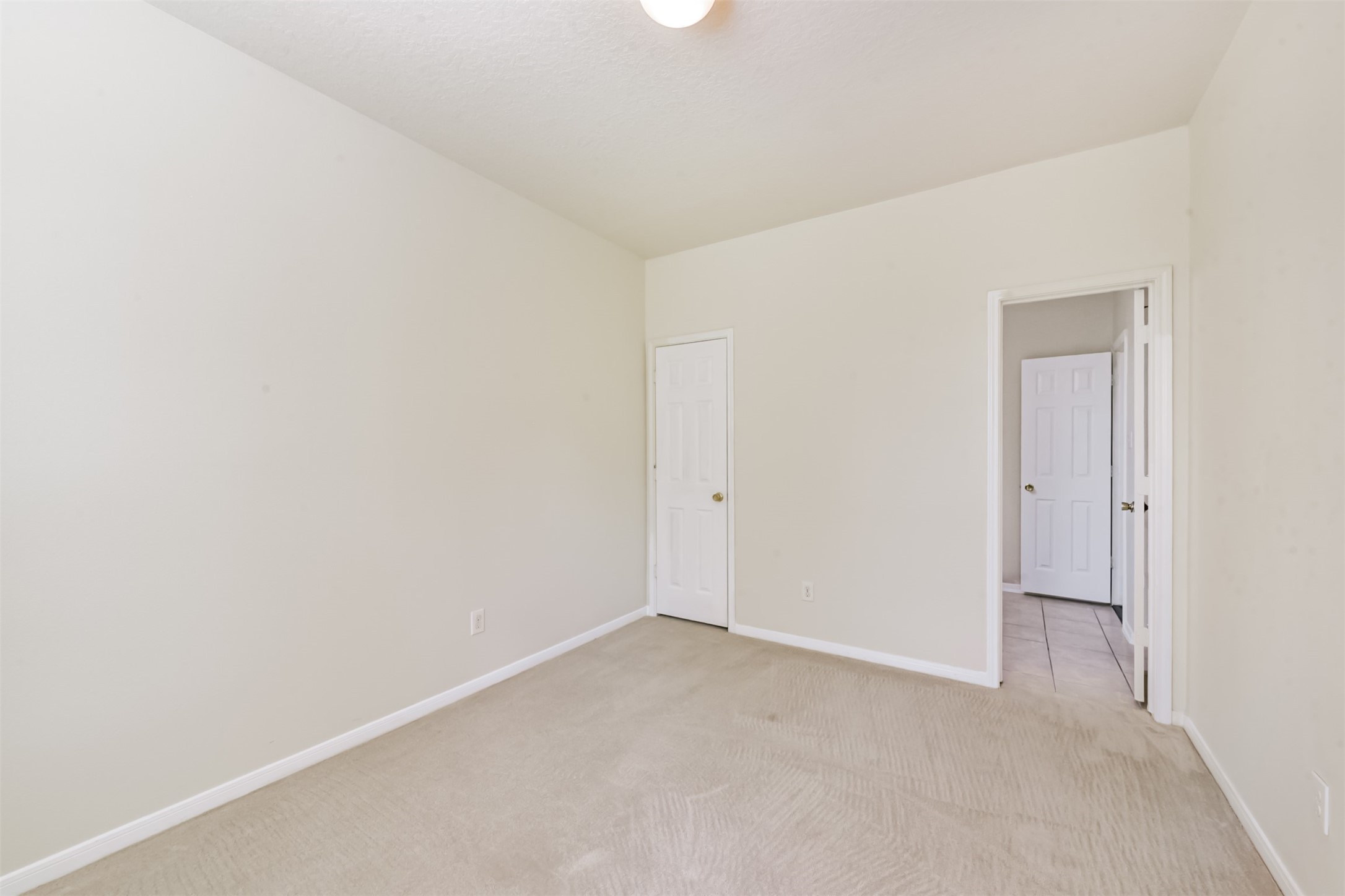 1810 Sun Point Court Humble, TX 77396 - Photo 17 of 38 a view of an empty room