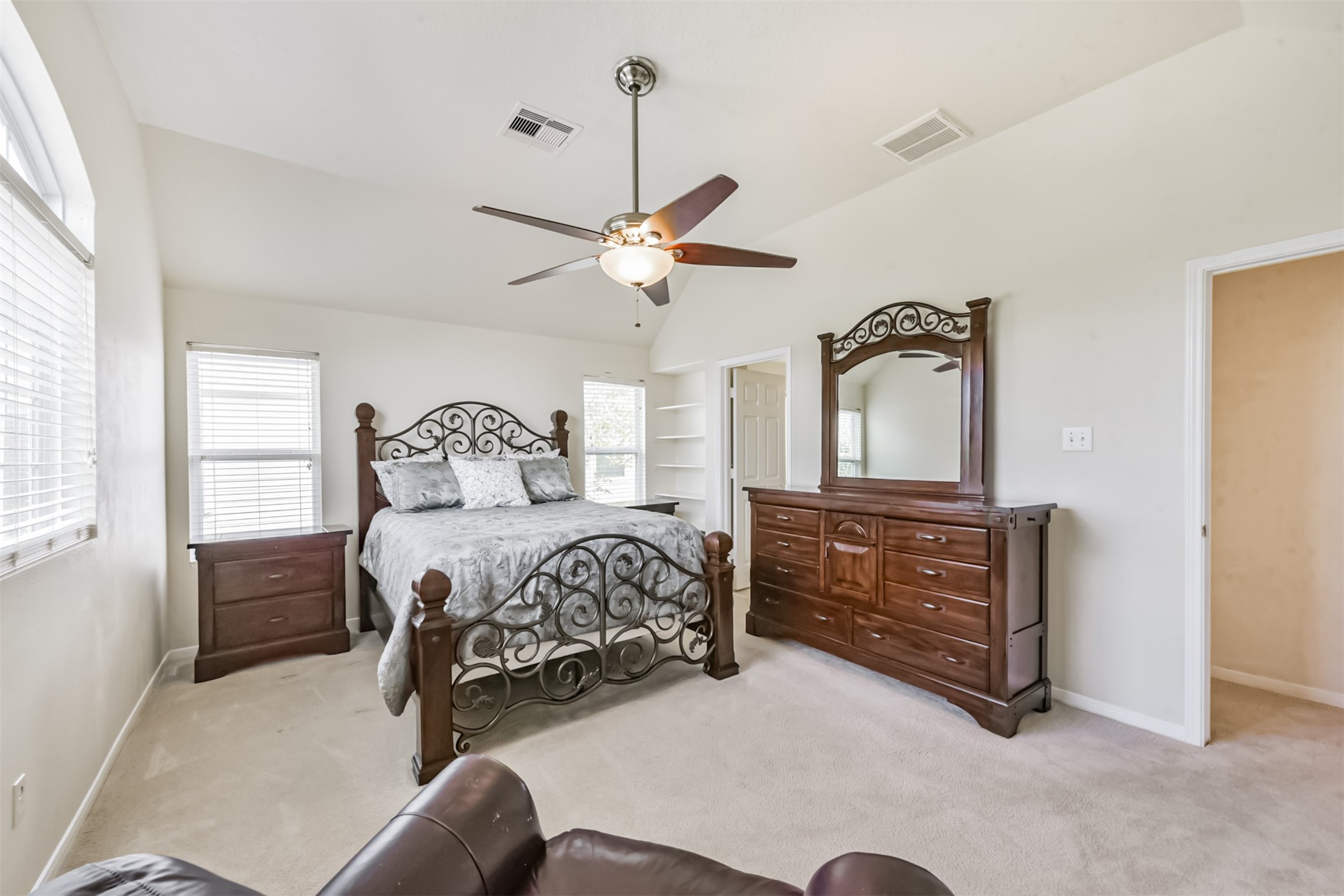 1810 Sun Point Court Humble, TX 77396 - Photo 24 of 38 a bedroom with a bed dresser and a window