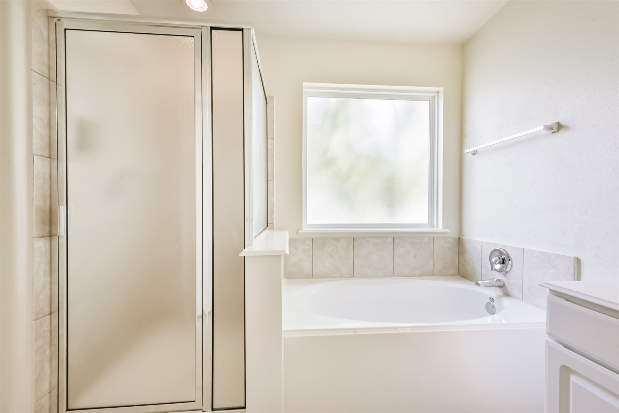 1810 Sun Point Court Humble, TX 77396 - Photo 28 of 38 a white bath tub sitting next to a shower
