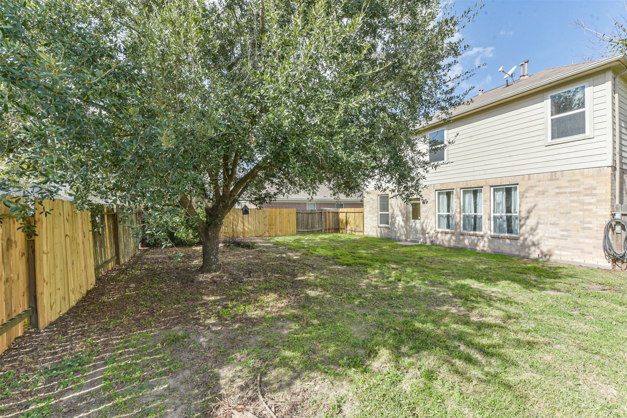 1810 Sun Point Court Humble, TX 77396 - Photo 36 of 38 a view of a house with a backyard