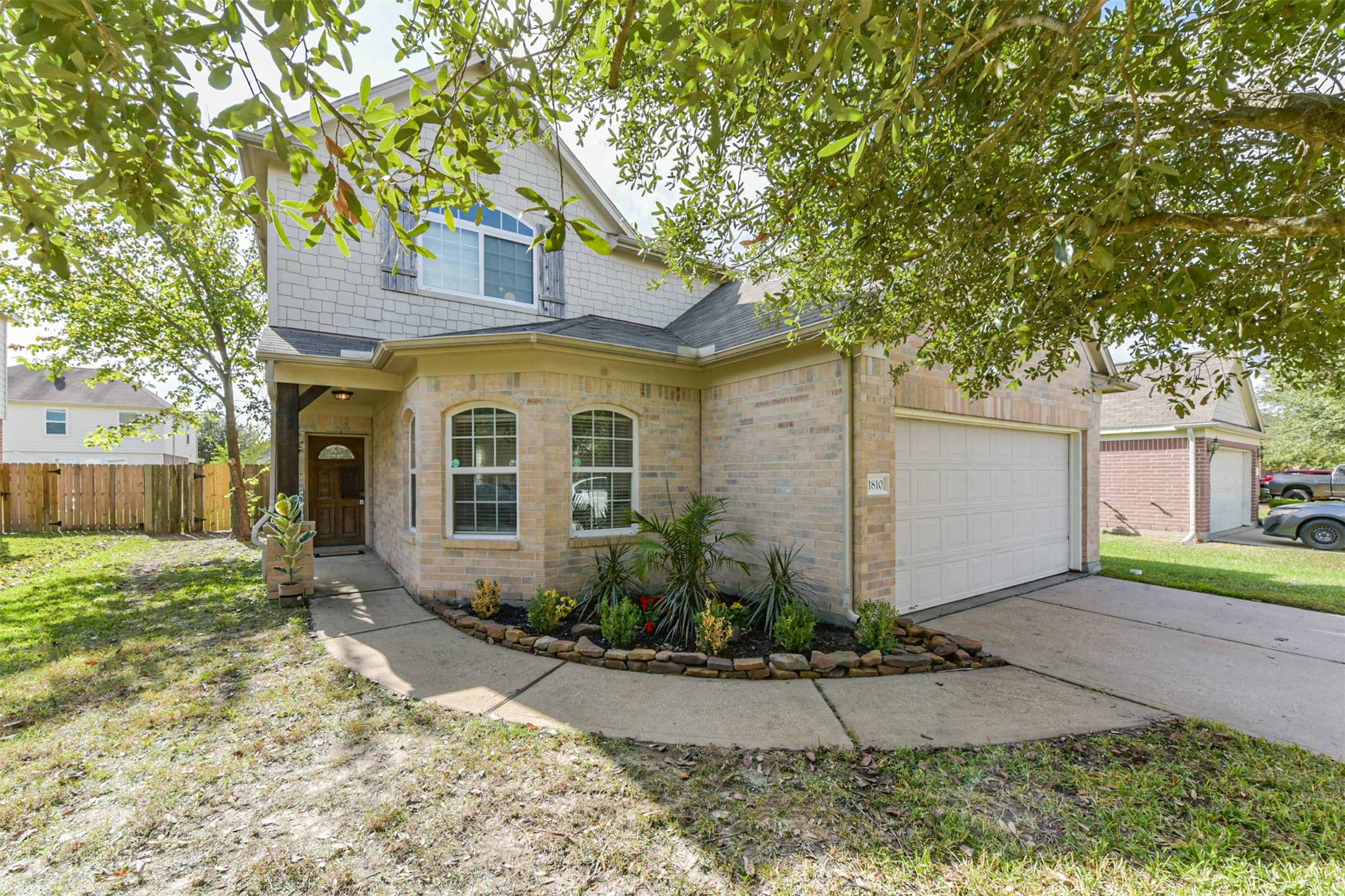 1810 Sun Point Court Humble, TX 77396 - Photo 4 of 38 a front view of a house with garden