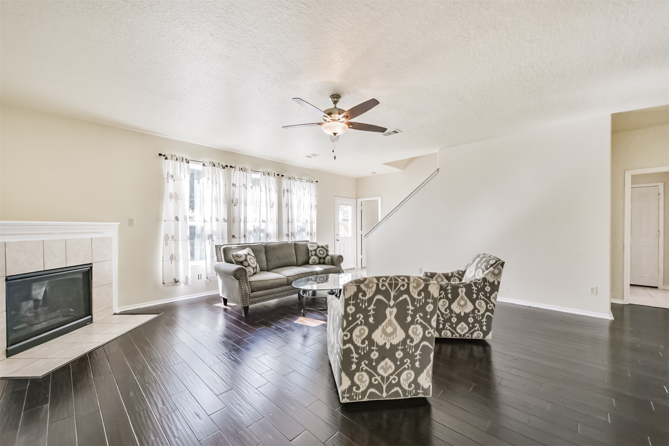 1810 Sun Point Court Humble, TX 77396 - Photo 7 of 38 a living room with furniture and a fireplace