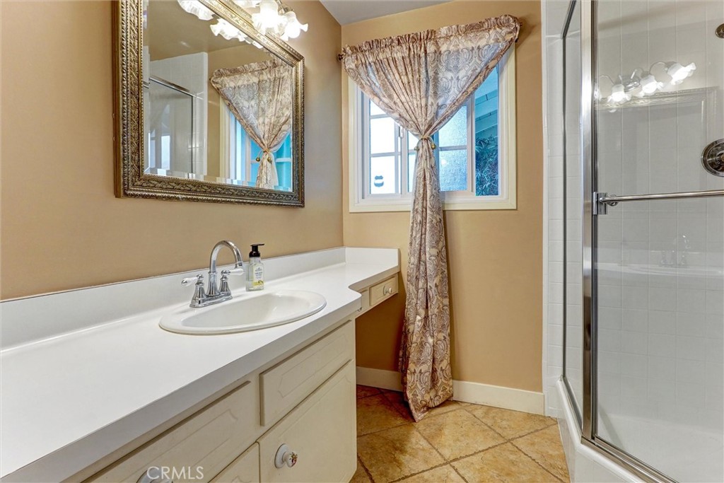 19238 Castlebay Lane Porter Ranch, CA 91326 - Photo 15 of 38 a bathroom with a sink and a mirror