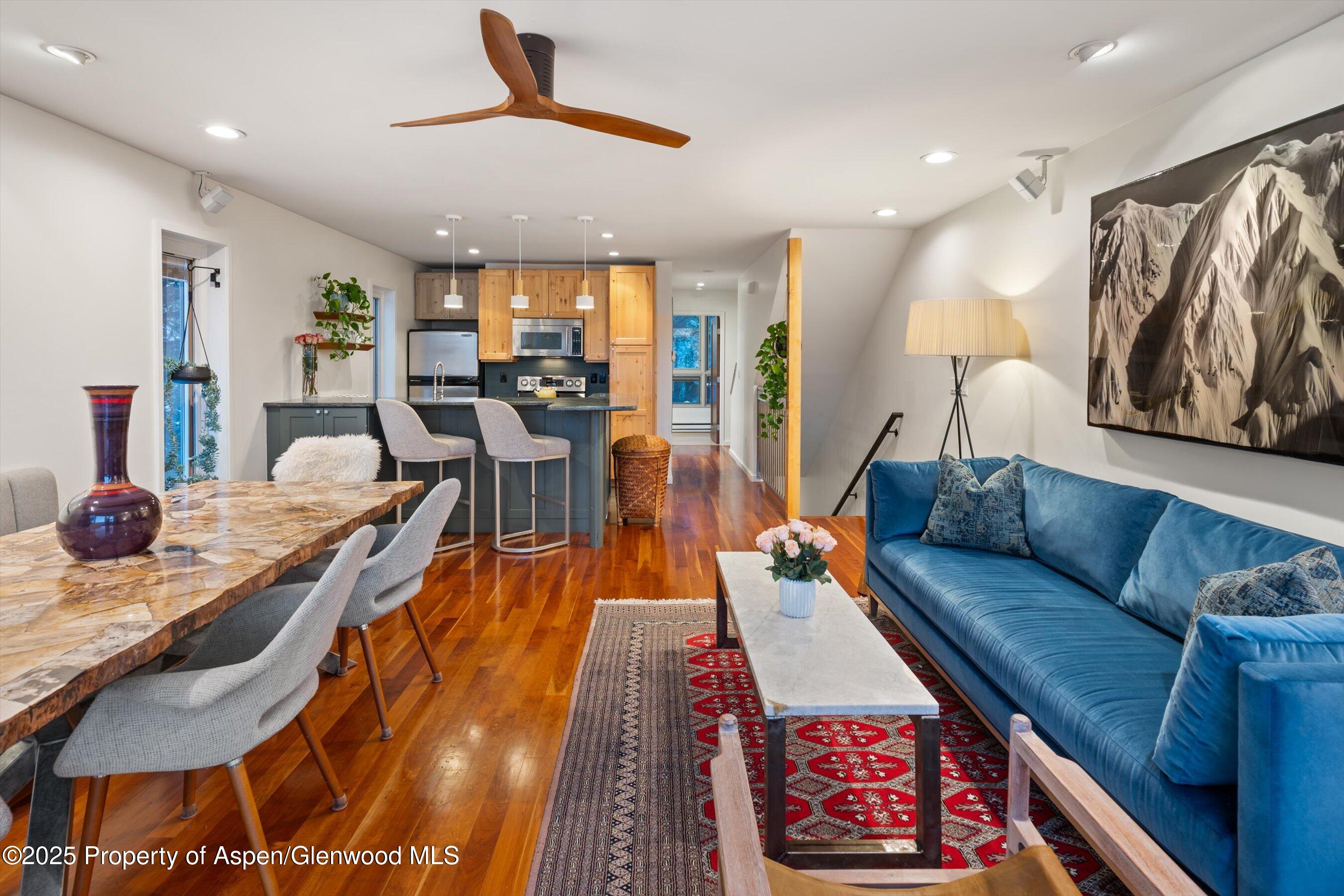 805 Pinon Drive, Unit 1 Basalt, CO 81621 - Photo 11 of 21 a living room with furniture and wooden floor