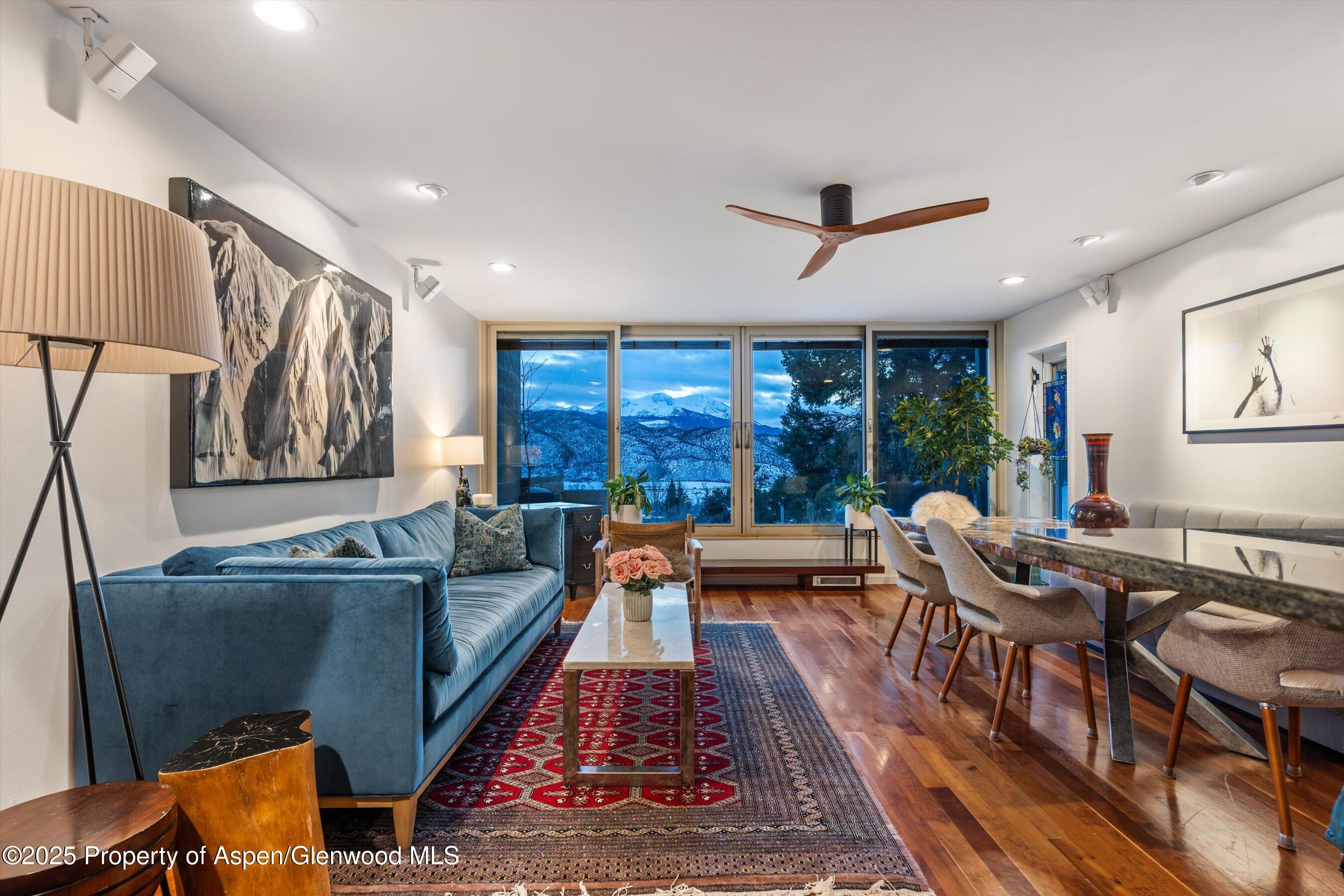805 Pinon Drive, Unit 1 Basalt, CO 81621 - Photo 3 of 21 a living room with furniture ceiling fan and a rug