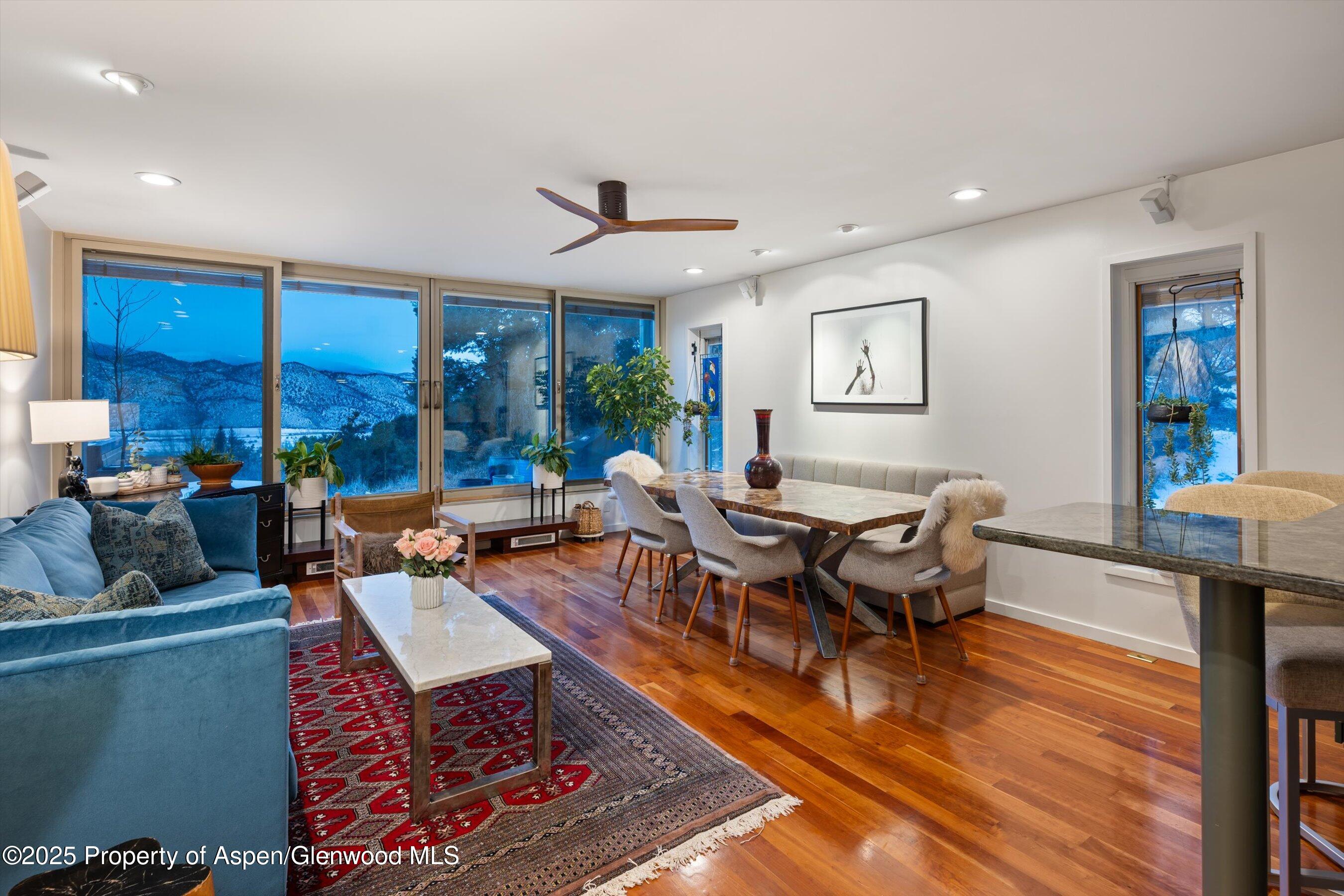 805 Pinon Drive, Unit 1 Basalt, CO 81621 - Photo 6 of 21 a living room with furniture a rug and a large window