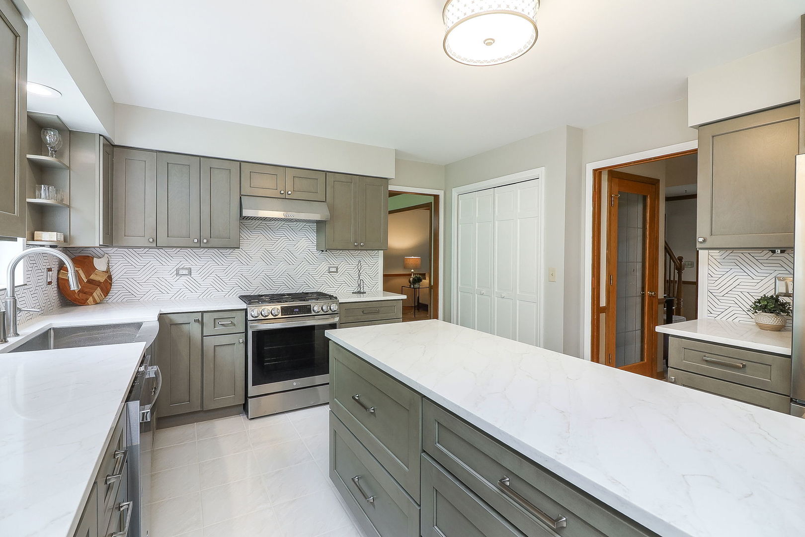 1736 Mundelein Road Naperville, IL 60565 - Photo 11 of 30 a kitchen with a stove and a sink