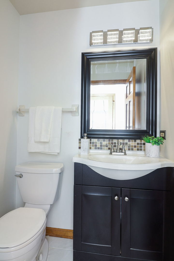 1736 Mundelein Road Naperville, IL 60565 - Photo 17 of 30 a bathroom with a sink and a toilet
