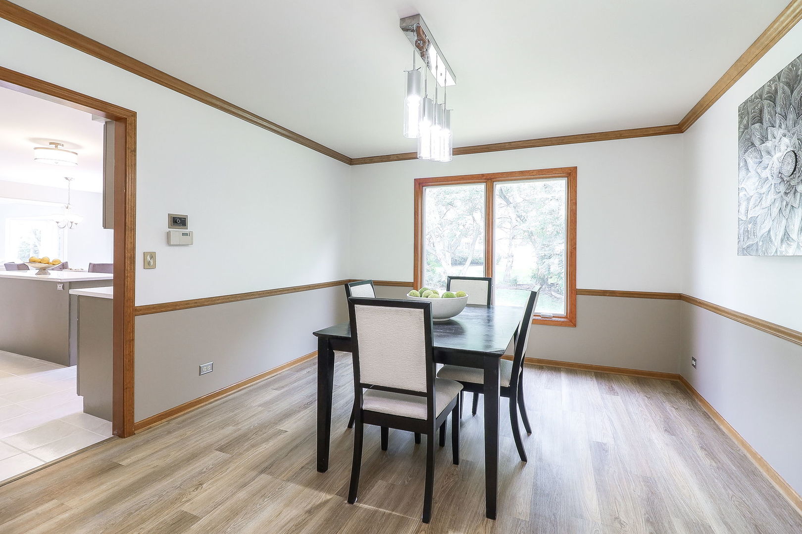 1736 Mundelein Road Naperville, IL 60565 - Photo 5 of 30 a view of a dining room with furniture window and wooden floor