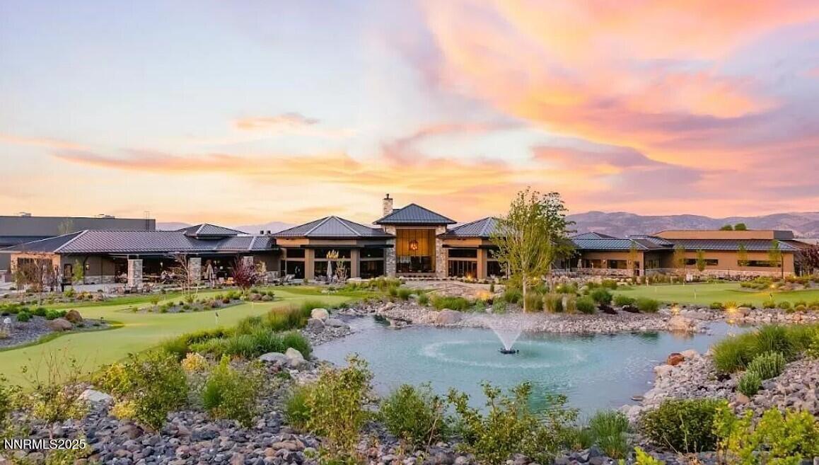 5728 Indigo Run Drive, Unit 1929 Reno, NV 89511 - Photo 6 of 10 a front view of a house with a garden and lake view