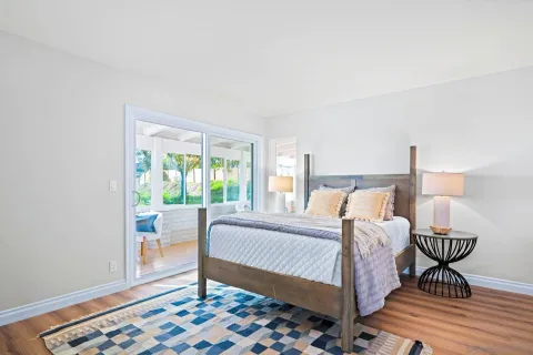 a bed room with a bed and a chair