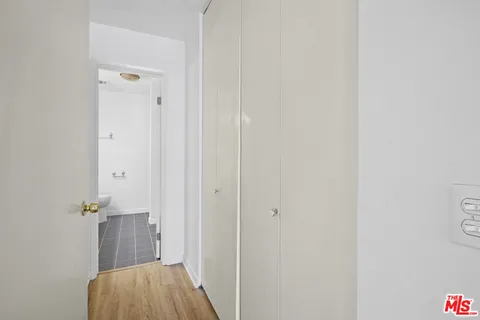 a view of kitchen with a refrigerator and a sink