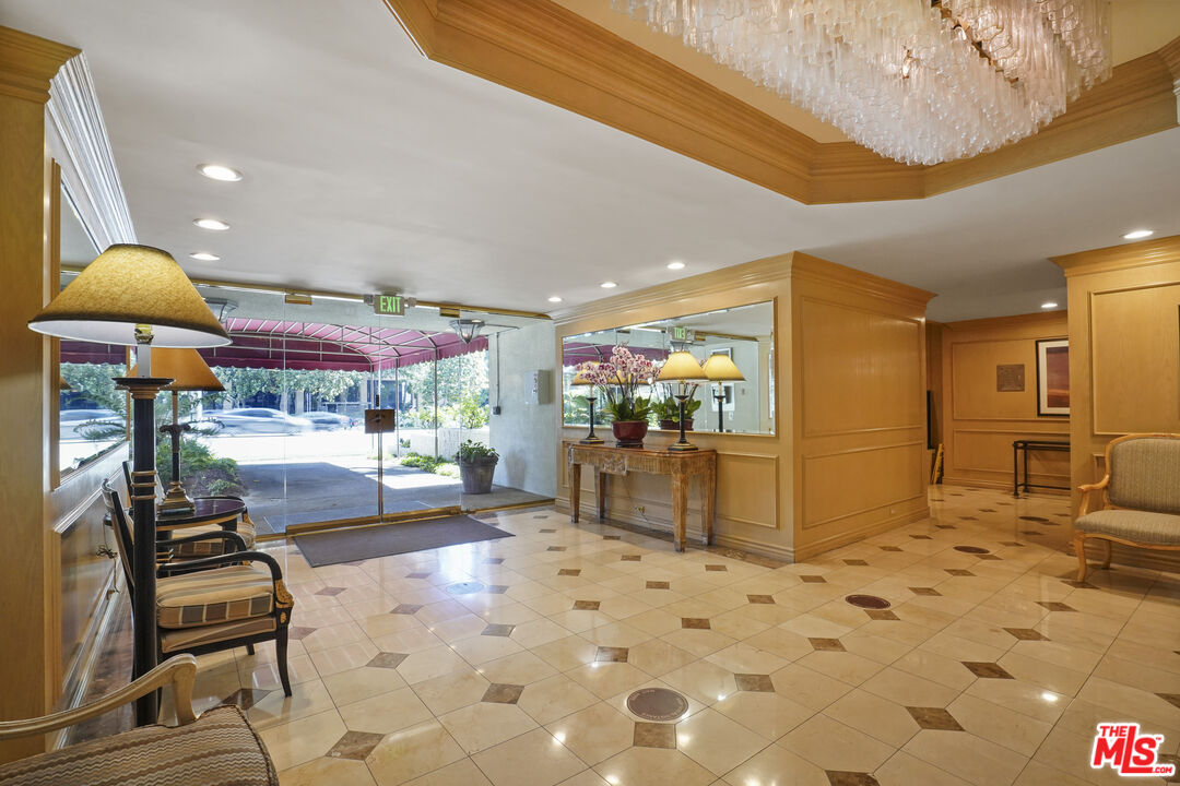 10751 Wilshire Boulevard, Unit PH 6 Los Angeles, CA 90024 - Photo 4 of 41 a lobby with furniture and rug