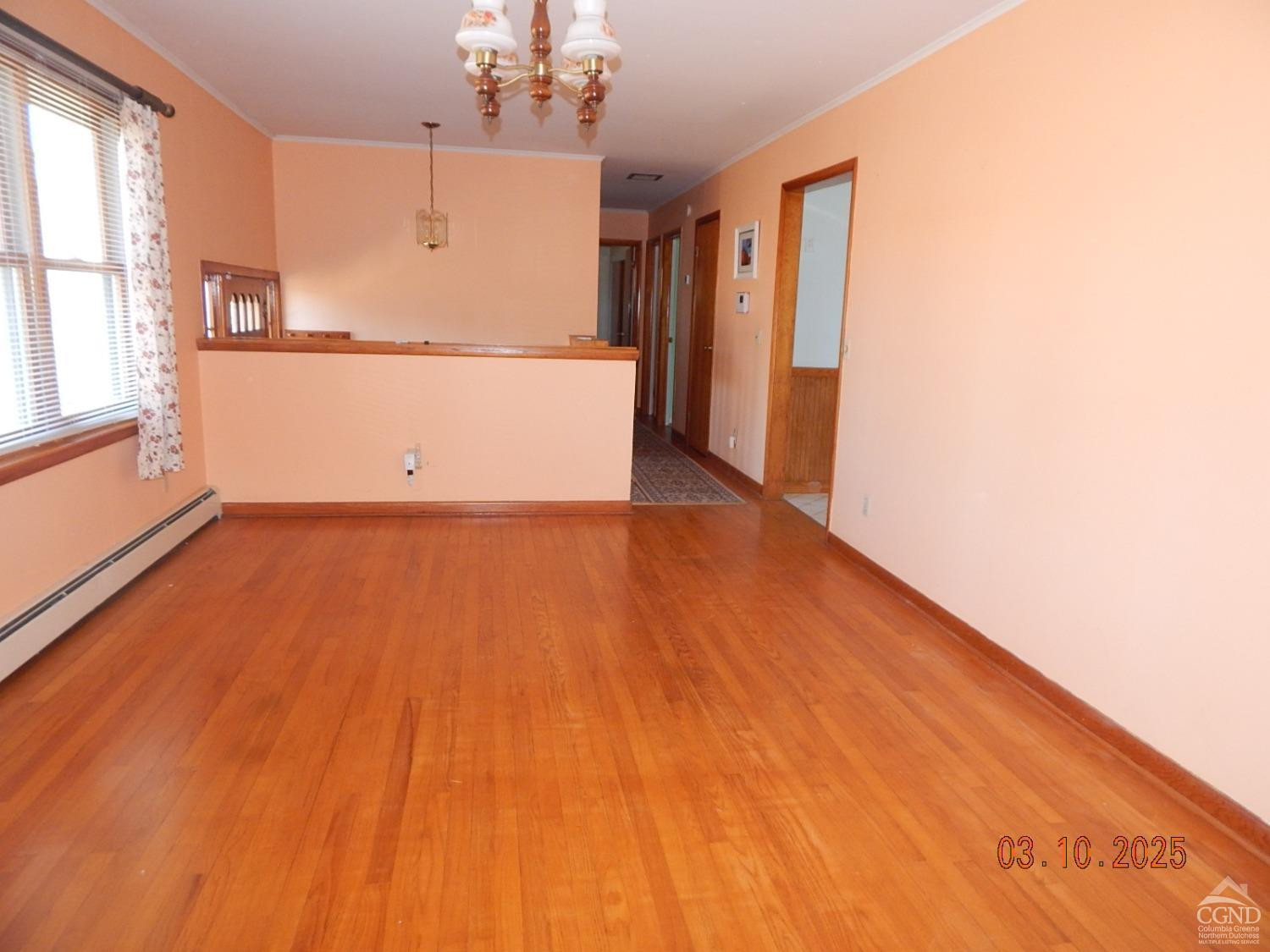 721 Irving Road Greenville, NY 12083 - Photo 14 of 29 a view of a kitchen with wooden floor and a refrigerator