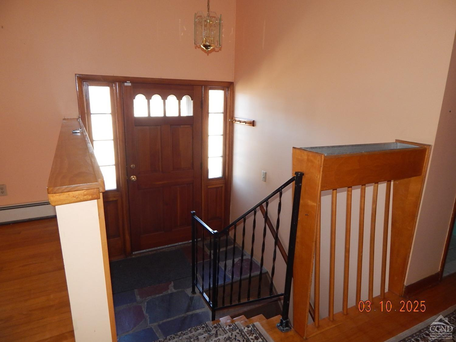 721 Irving Road Greenville, NY 12083 - Photo 17 of 29 a view of a hallway with wooden floor and stairs