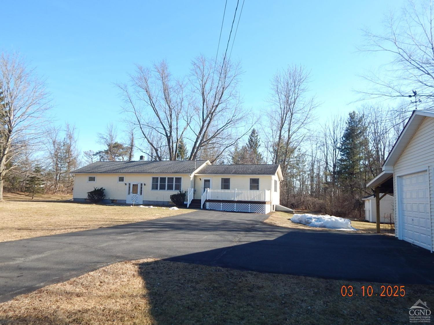721 Irving Road Greenville, NY 12083 - Photo 9 of 29 a front view of a house with a yard and large trees
